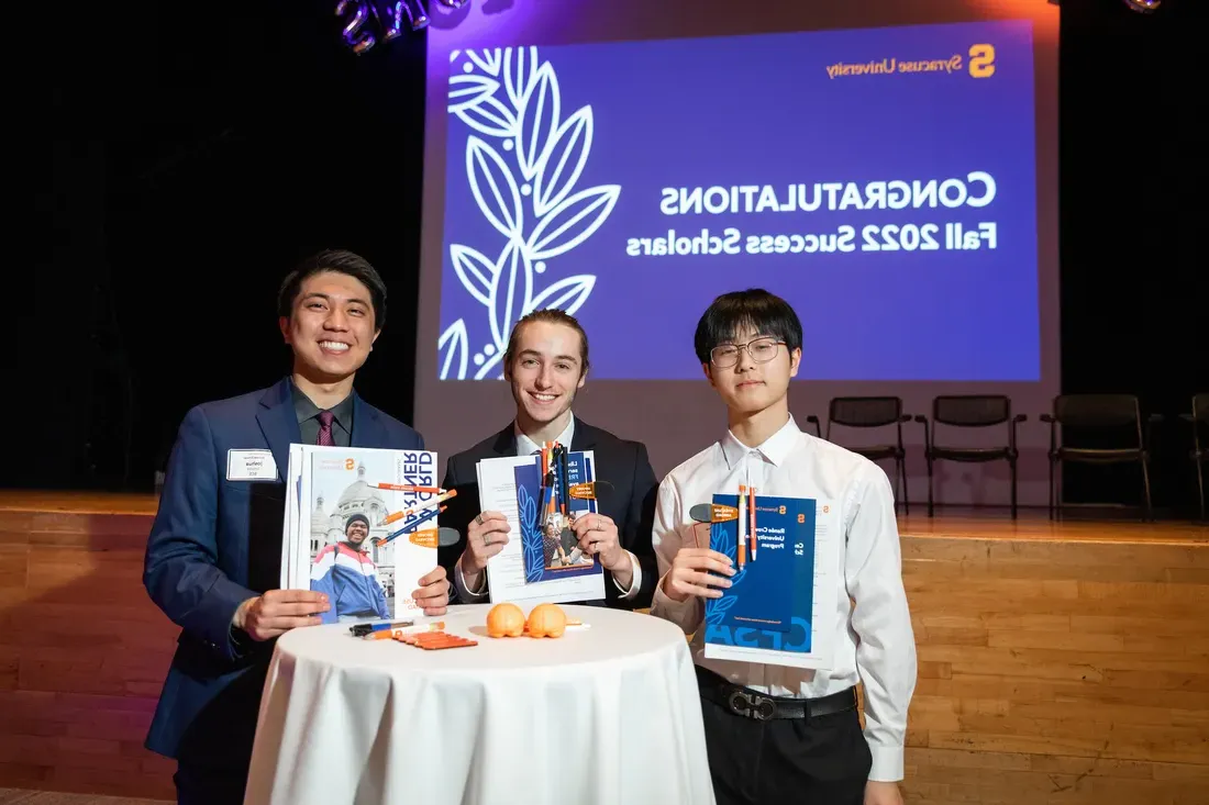 Three people after winning an award.